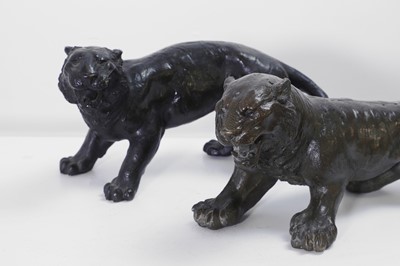 Lot 355 - Two bronze lionesses