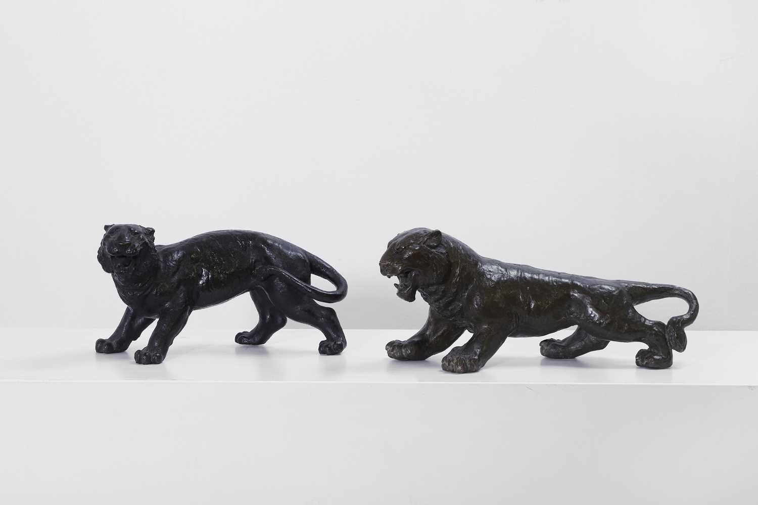 Lot 355 - Two bronze lionesses
