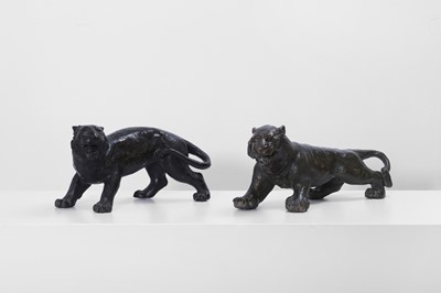Lot 355 - Two bronze lionesses