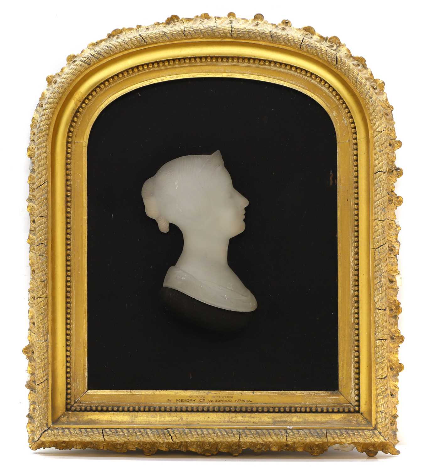 Lot 134 - A pair of opaque glass silhouettes of Queen Victoria and Prince Albert