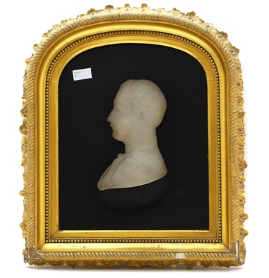 Lot 134 - A pair of opaque glass silhouettes of Queen Victoria and Prince Albert