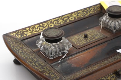 Lot 160 - A Regency rosewood desk stand with brass inlay