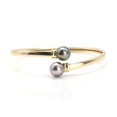 Lot 129 - A Tahitian pearl torque bangle