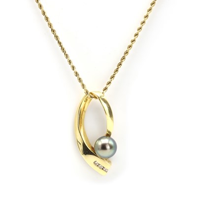 Lot 130 - A cultured Tahitian pearl and diamond pendant on chain