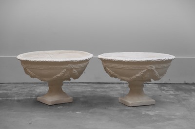 Lot 553 - A pair of cast plaster urns