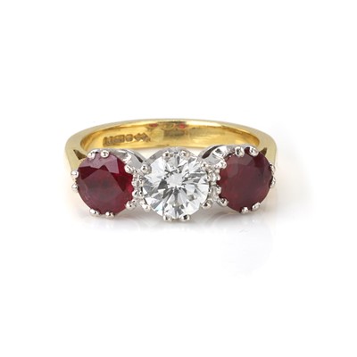 Lot 195 - An 18ct gold ruby and diamond three stone ring