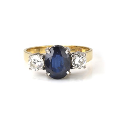 Lot 1129 - A sapphire and diamond ring