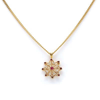Lot 120 - An 18ct gold ruby and diamond pendant on chain