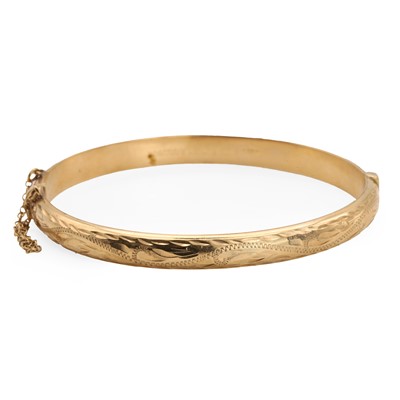 Lot 74 - A 9ct gold hinged bangle