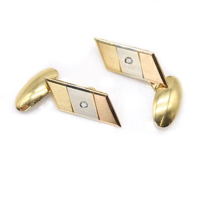 Lot 257 - A pair of tricoloured gold diamond set cufflinks