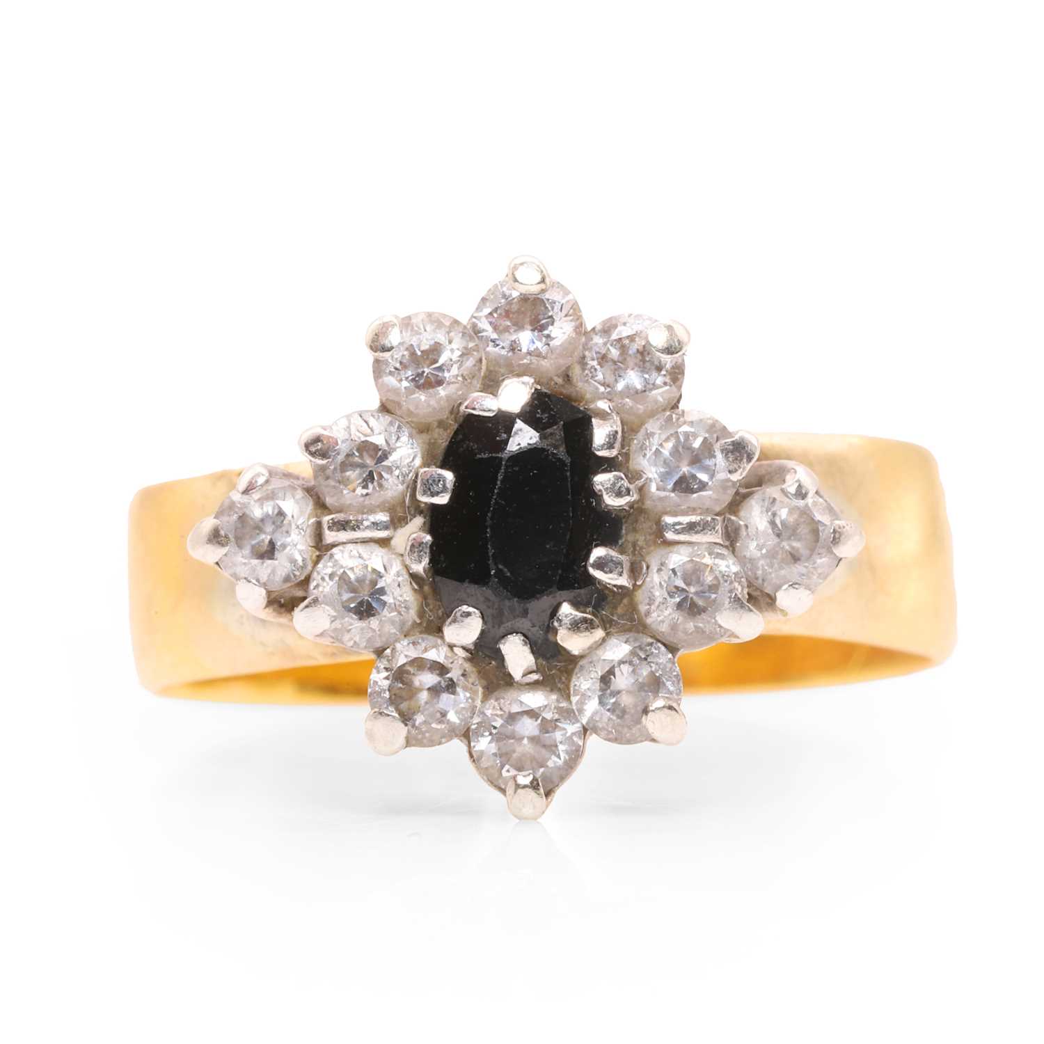 Lot 83 - A sapphire cluster ring