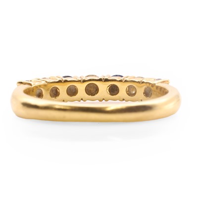 Lot 78 - An 18ct gold diamond and sapphire half eternity ring