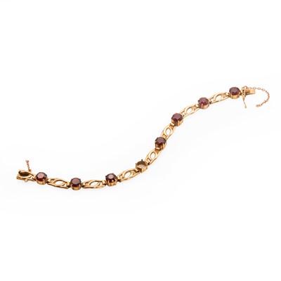 Lot 100 - A 9ct gold garnet set bracelet