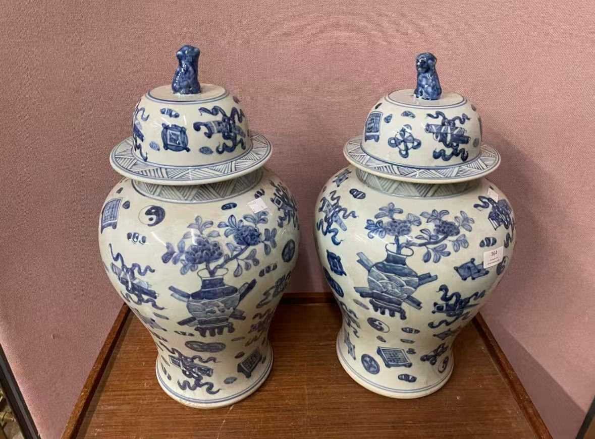 Lot 60 - A pair of Chinese blue and white vases and covers