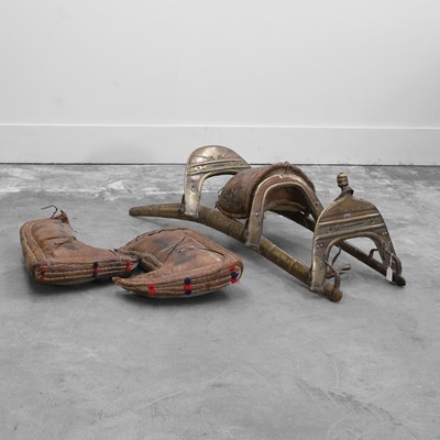 Lot 304 - A wood and brass camel saddle