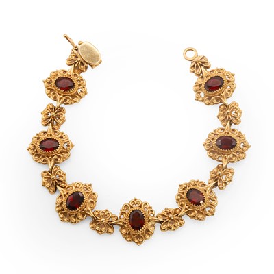 Lot 102 - A 9ct gold garnet panel bracelet