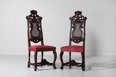 Lot 181 - A pair of carved walnut side chairs