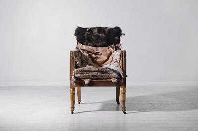 Lot 187 - A Regency painted and parcel-gilt wooden armchair