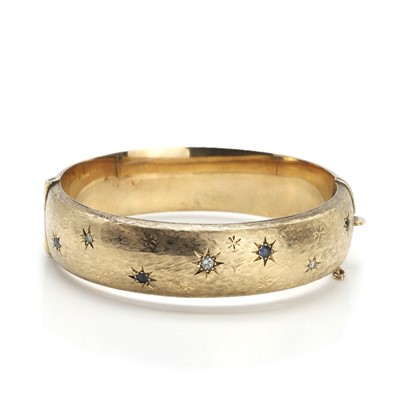 Lot 68 - A 9ct gold sapphire and diamond bangle