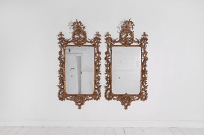 Lot 193 - A pair of George III carved giltwood pier mirrors