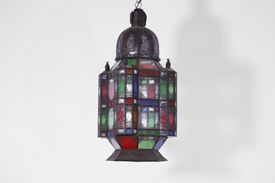 Lot 489 - A patinated metal and stained-glass lantern