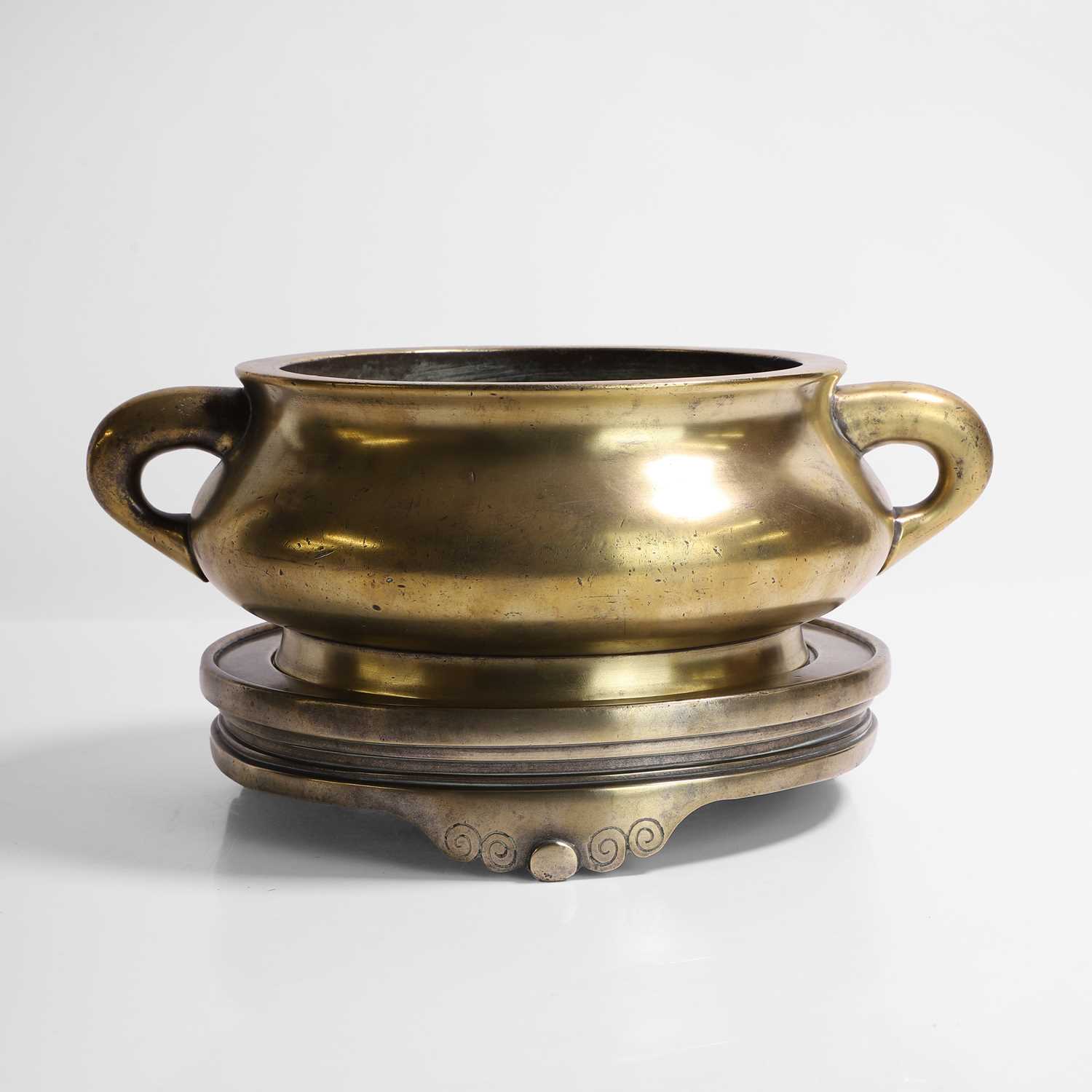 Lot 133 - A Chinese bronze incense burner and stand