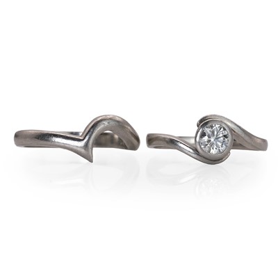 Lot 62 - A platinum diamond single stone ring and a platinum fitted band ring