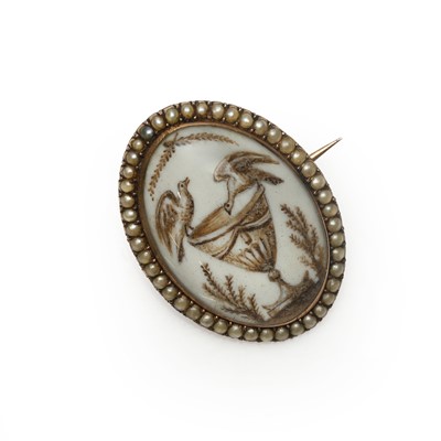 Lot 3 - A Georgian split pearl miniature portrait memorial brooch