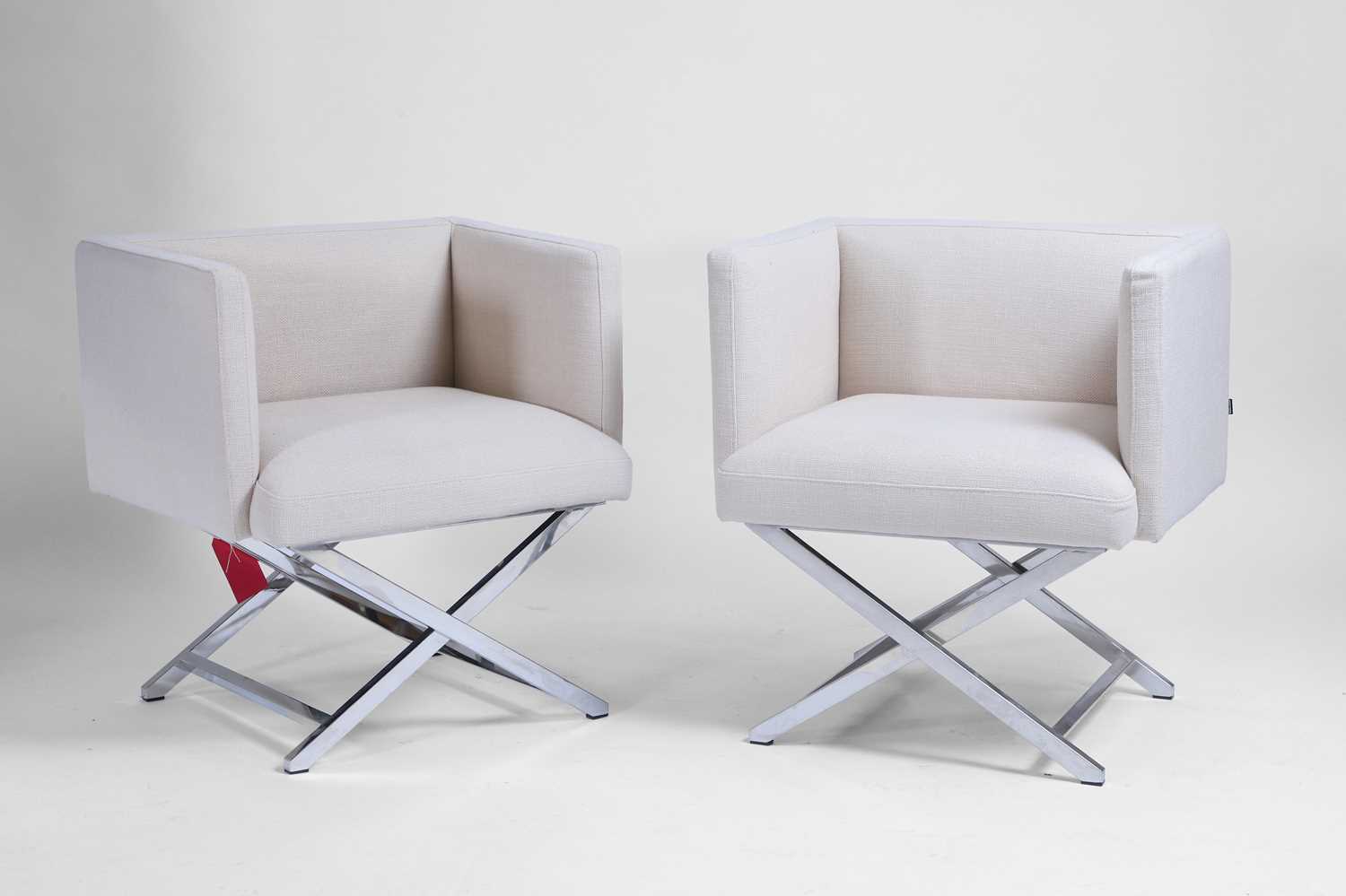 Lot 543 - A pair of contemporary white armchairs