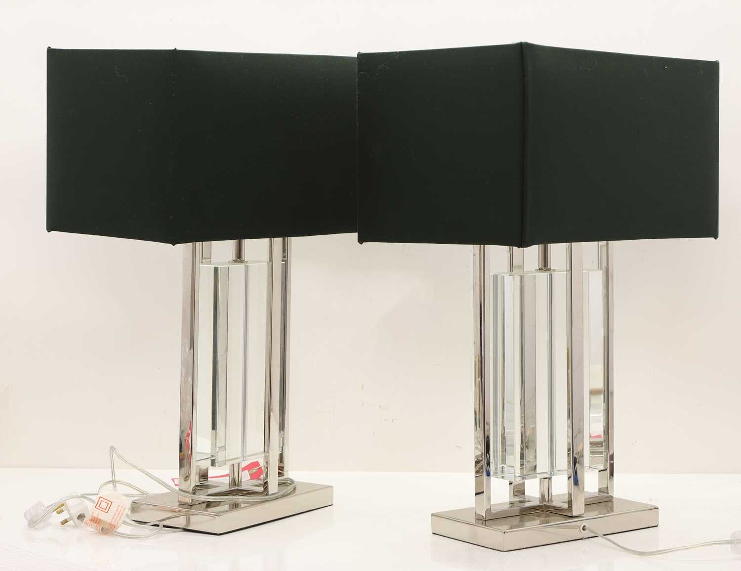 Lot 526 - A pair of contemporary chrome and glass table lamps