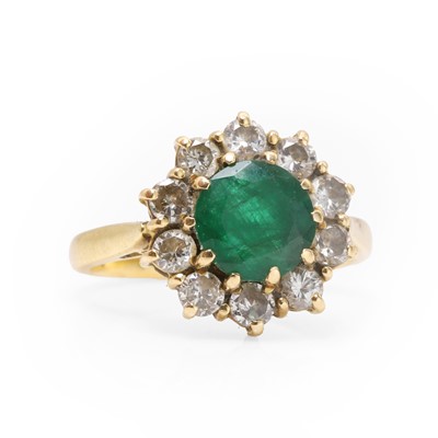 Lot 88 - An 18ct gold emerald and diamond cluster ring