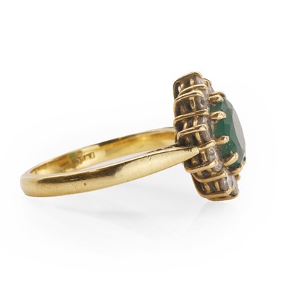 Lot 88 - An 18ct gold emerald and diamond cluster ring