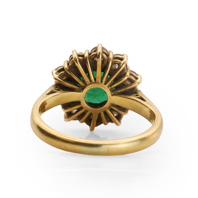 Lot 88 - An 18ct gold emerald and diamond cluster ring