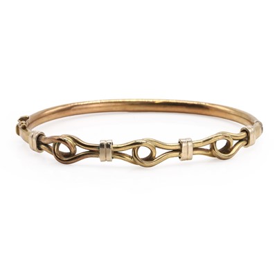 Lot 1066 - A hollow gold hinged bangle