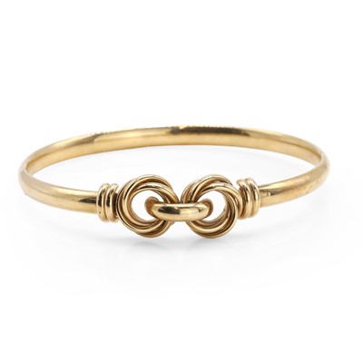 Lot 1102 - A 9ct gold hinged bangle