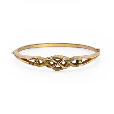 Lot 1067 - A gold hinged plaited bangle
