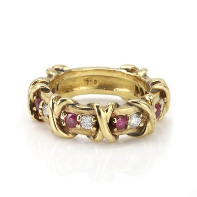 Lot 124 - A gold ruby and diamond band ring