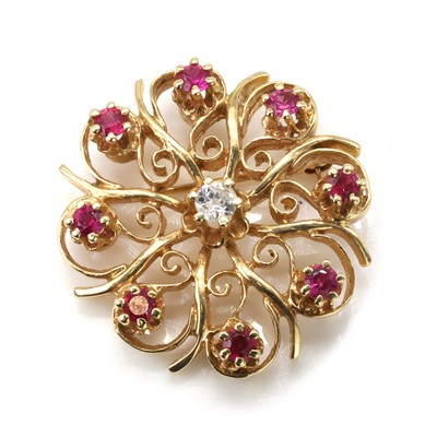 Lot 102 - A diamond and synthetic ruby floral brooch/pendant