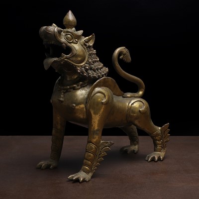 Lot 217 - A large Nepalese bronze model of a guardian lion