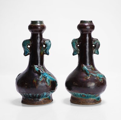 Lot 24 - A pair of Chinese fahua-type garlic vases