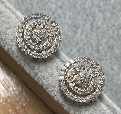 Lot 70 - A pair of 9ct gold diamond cluster stud earrings