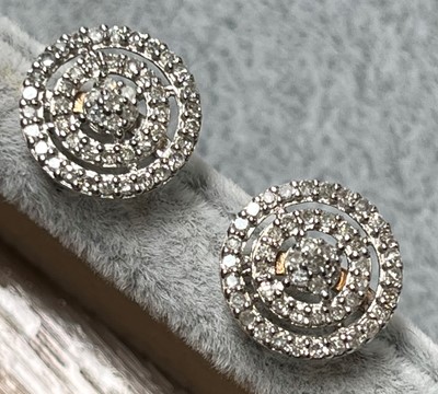 Lot 70 - A pair of 9ct gold diamond cluster stud earrings