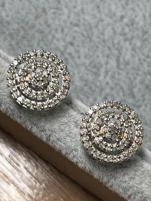 Lot 70 - A pair of 9ct gold diamond cluster stud earrings