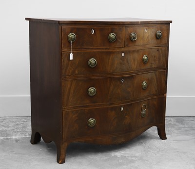 Lot 507 - A George III mahogany inlaid serpentine chest of drawers