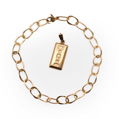 Lot 201 - A 9ct gold ingot pendant and a cable link bracelet