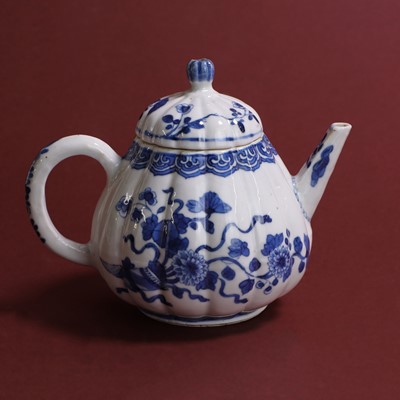 Lot 36 - A Chinese blue and white teapot and cover.