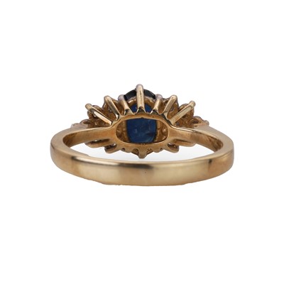 Lot 73 - A 9ct gold sapphire and diamond cluster ring