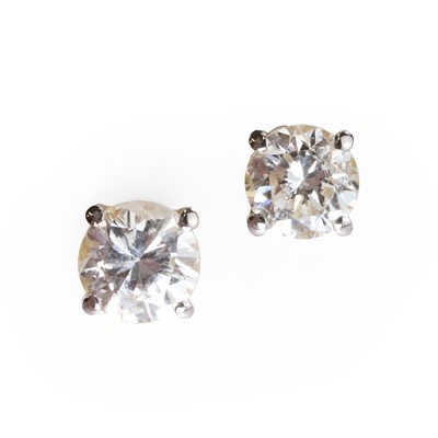 Lot 1046 - A pair of 18ct gold diamond stud earrings