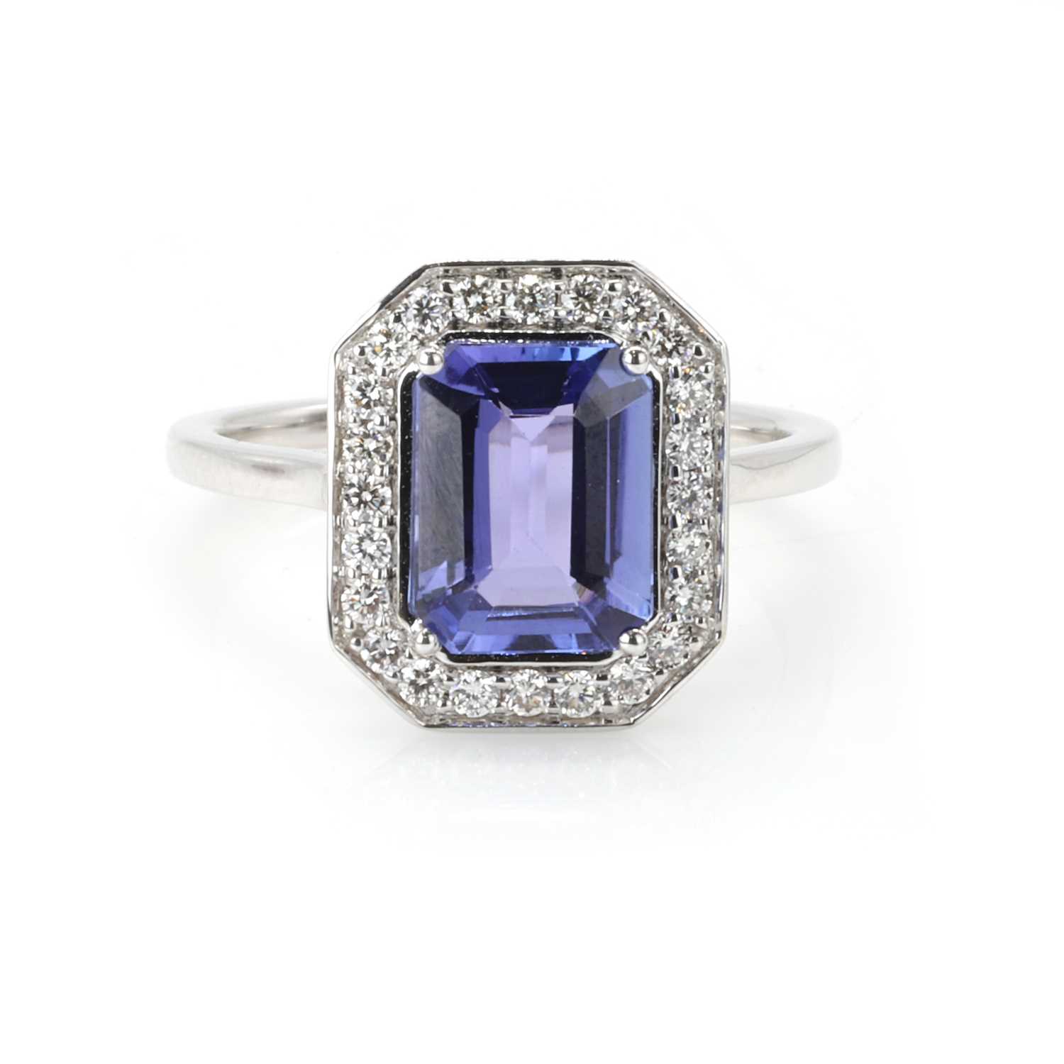Lot 166 - An 18ct white gold tanzanite and diamond cluster ring