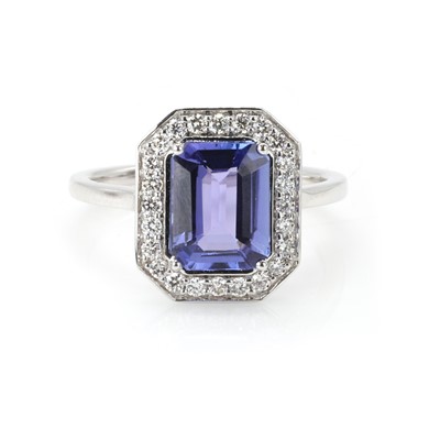 Lot 166 - An 18ct white gold tanzanite and diamond cluster ring